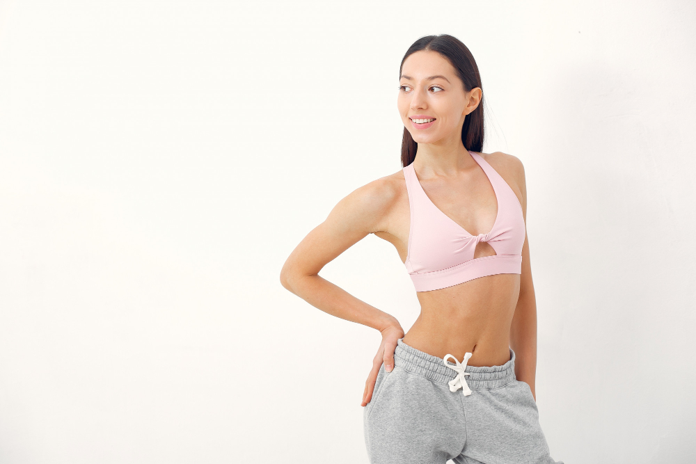 Woman smiling in pink activewear
